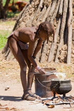 A Humba boy cooks lunch A Himba boy cooks lunch